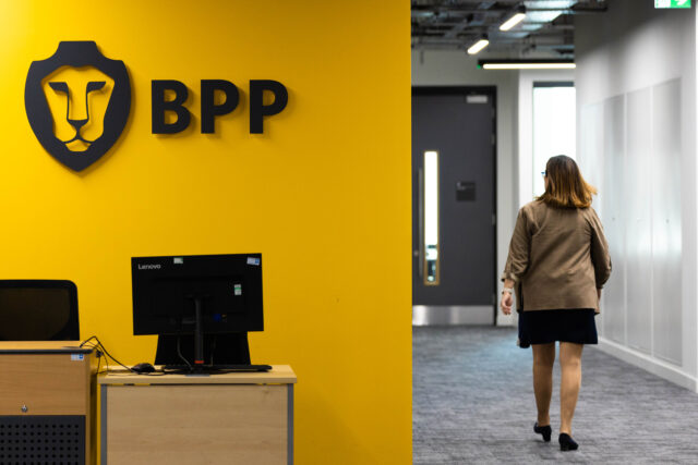 BPP Aldgate with person walking along corridor