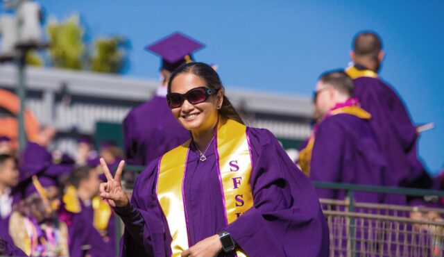 SFSU student in graduation clothes