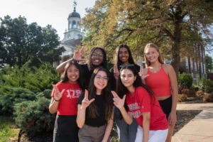 Group of UoL students smiling at camera