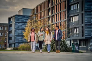 ENU students enjoying campus life outside modern university accommodation