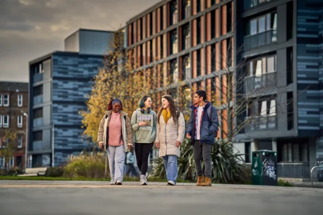 ENU students enjoying campus life outside modern university accommodation