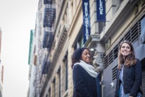 Two female students outside Mercy Uni in Manhattan