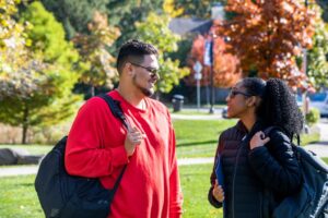 Two students talking outside on Mercy campus