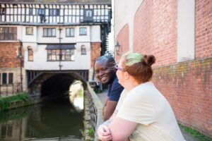 Two students stood by the river in Lincoln