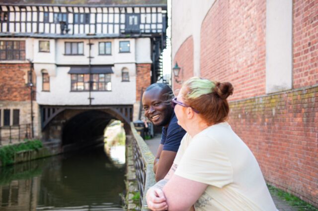 Two students stood by the river in Lincoln