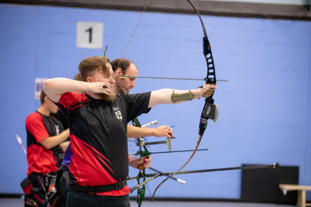 University of Dundee student practicing archery at campus sports facility