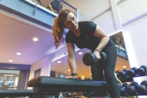 University of Dundee student lifting weights at campus gym