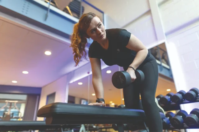 University of Dundee student lifting weights at campus gym